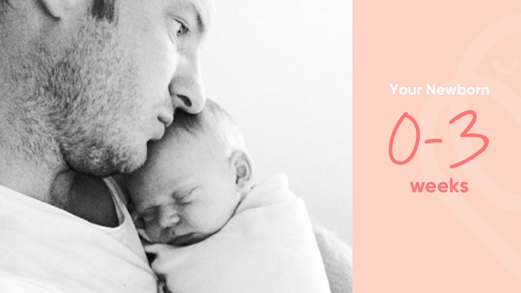 sleeping newborn in dad's arms
