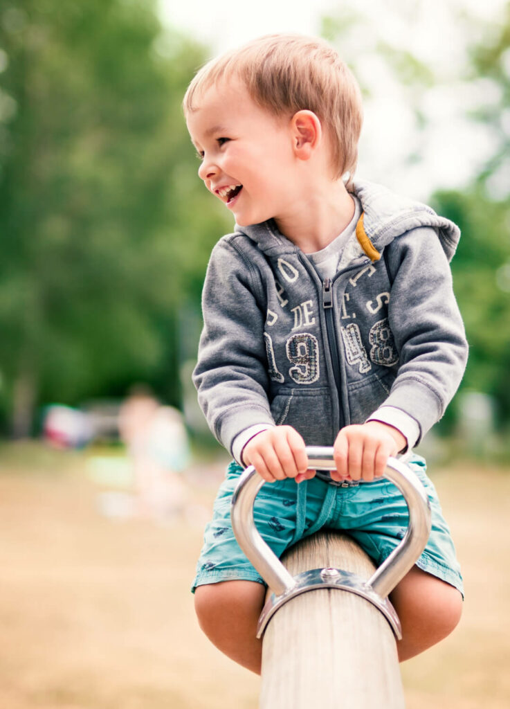 boy playing on see-saw