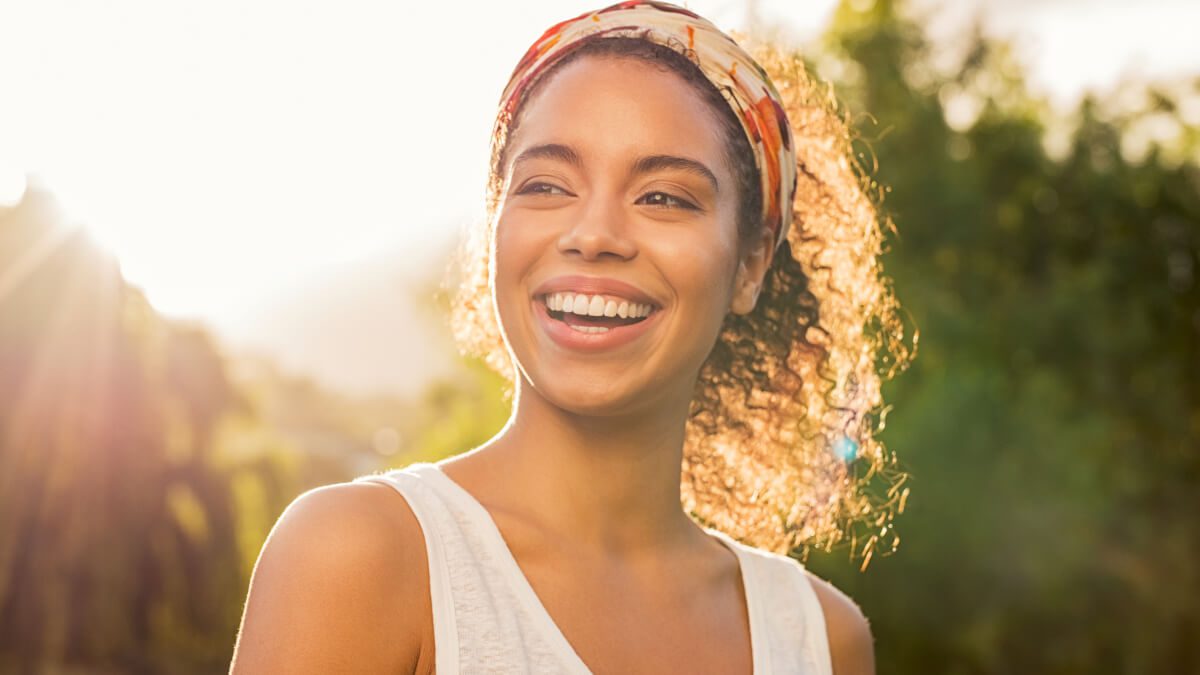 smiling woman in the sunshine