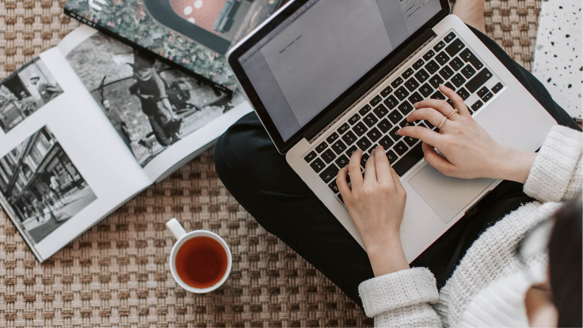woman typing on laptop