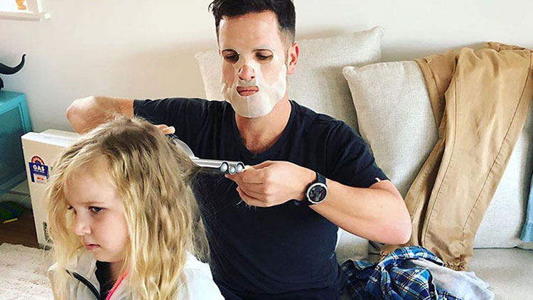 dad doing daughter's hair