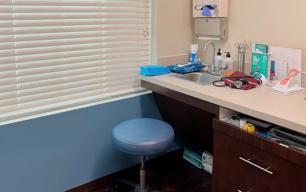 Exam room, medical supplies ready.